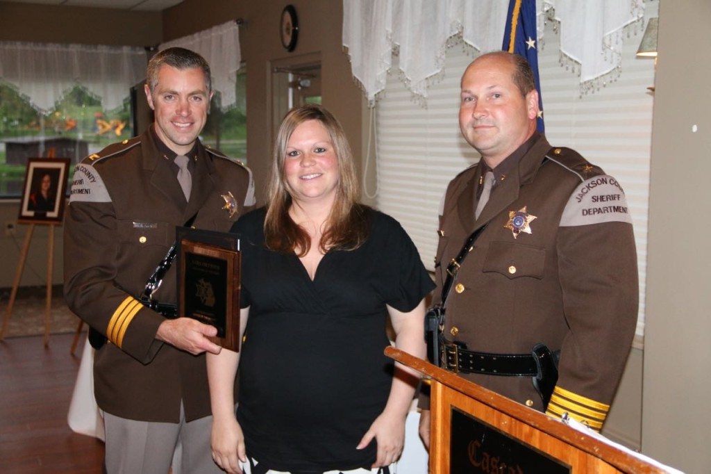 Dispatcher of the Year Tara Ortwine with Undersheriff Chris Kuhl and Sheriff Steve Rand