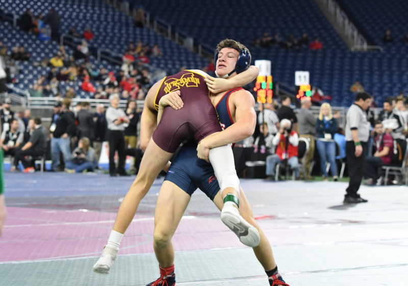 Hanover-Horton High School wrestler Chris Sorrow, right, lifts his opponent during the Michigan High School Athletic Association state individual wrestling finals Saturday at Ford Field in Detroit.